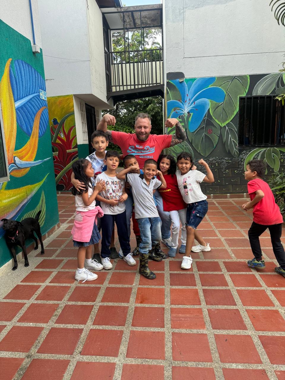 Jason Hill with children at an orphanage in Medellín, Colombia